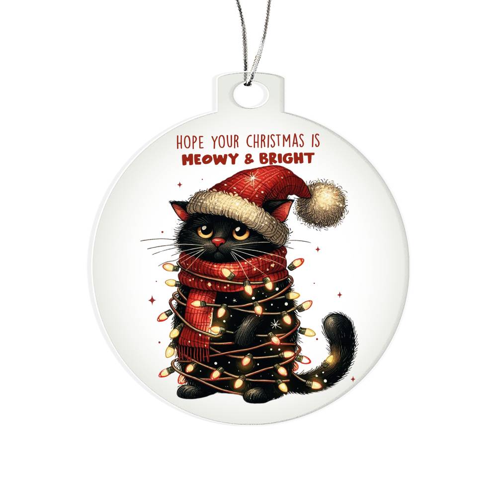 Black cat tangled in Christmas lights with a playful holiday message.