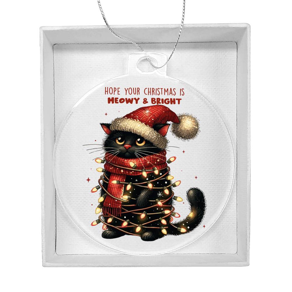 Black cat tangled in Christmas lights with a playful holiday message.