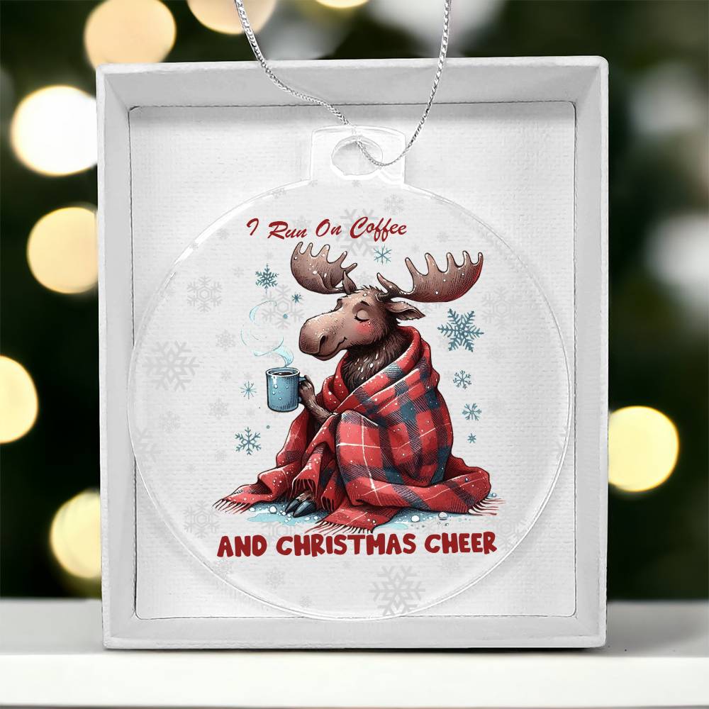 Moose wrapped in blanket holding coffee with "I run on coffee and Christmas cheer" text.
